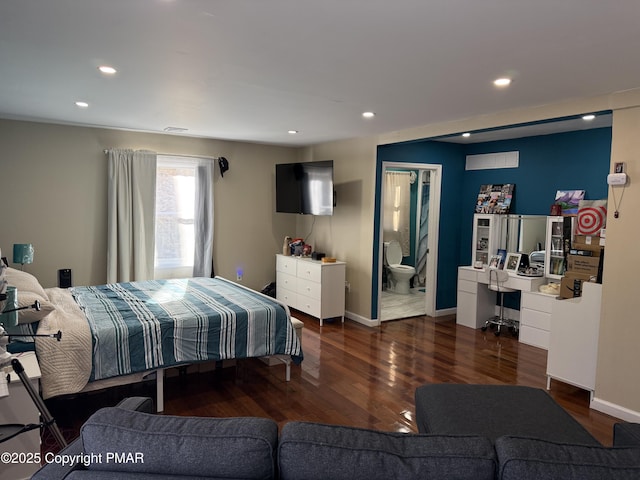 bedroom with connected bathroom, recessed lighting, wood finished floors, visible vents, and baseboards