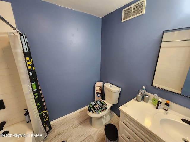 bathroom with baseboards, visible vents, vanity, and toilet