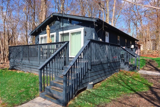 5306 Ledgewood Dr, Tobyhanna, PA 18466 - exterior space with a deck, a lawn, and stairs