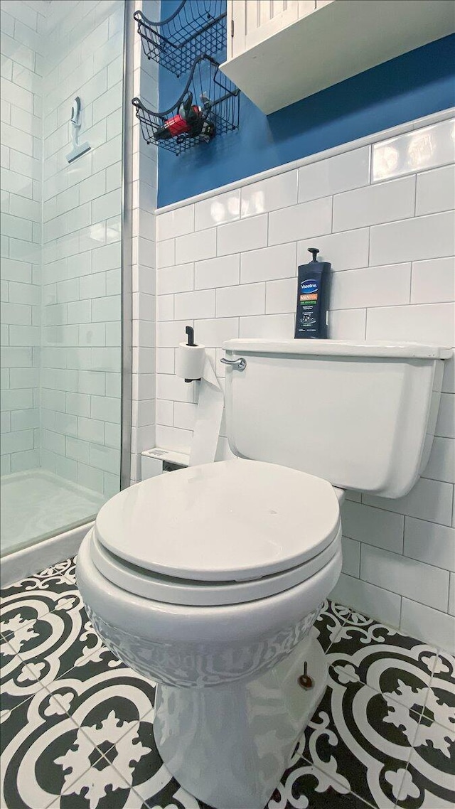 106 Silver Ln, Cresco, PA 18326 - bathroom with tile walls, toilet, and a shower stall