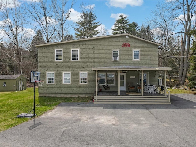 106 Silver Ln, Cresco, PA 18326 - view of front of house featuring a front lawn and an outdoor structure