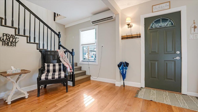 106 Silver Ln, Cresco, PA 18326 - entrance foyer with a wall unit AC, stairway, wood finished floors, and baseboards