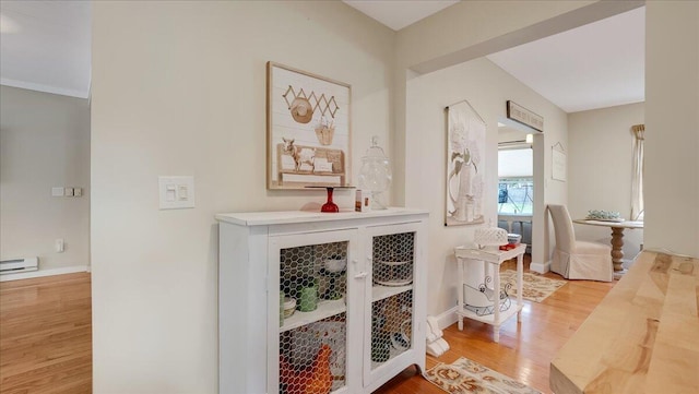106 Silver Ln, Cresco, PA 18326 - hall with wood finished floors, baseboards, and a baseboard radiator