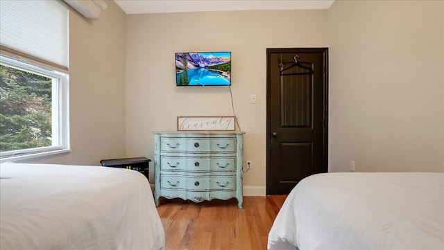 106 Silver Ln, Cresco, PA 18326 - bedroom with multiple windows and wood finished floors