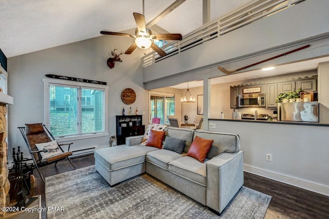 living room featuring ceiling fan with notable chandelier, high vaulted ceiling, dark hardwood / wood-style floors, and a healthy amount of sunlight