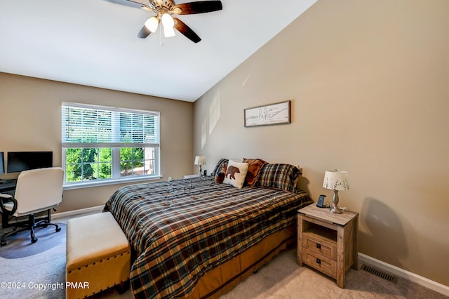 bedroom with light carpet, baseboards, visible vents, and lofted ceiling