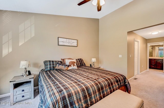 carpeted bedroom with a ceiling fan and baseboards