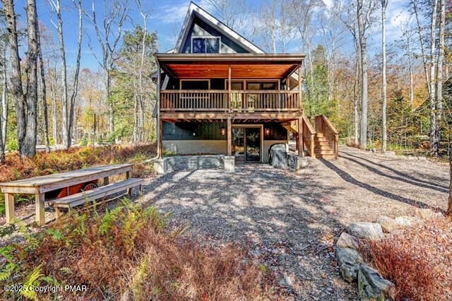 view of front of house featuring a deck and stairs