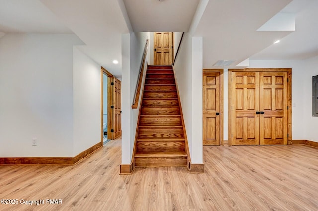 stairs featuring recessed lighting, baseboards, and wood finished floors