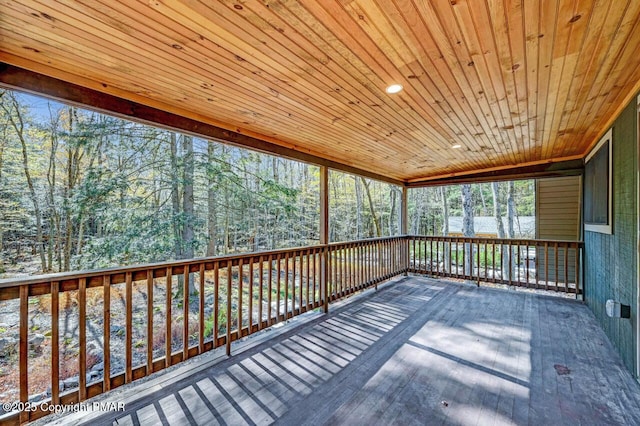 unfurnished sunroom featuring wooden ceiling