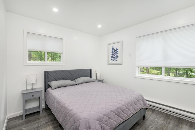 2162 Glasgow Dr, Bushkill, PA 18324 - bedroom featuring a baseboard heating unit, wood finished floors, multiple windows, and recessed lighting