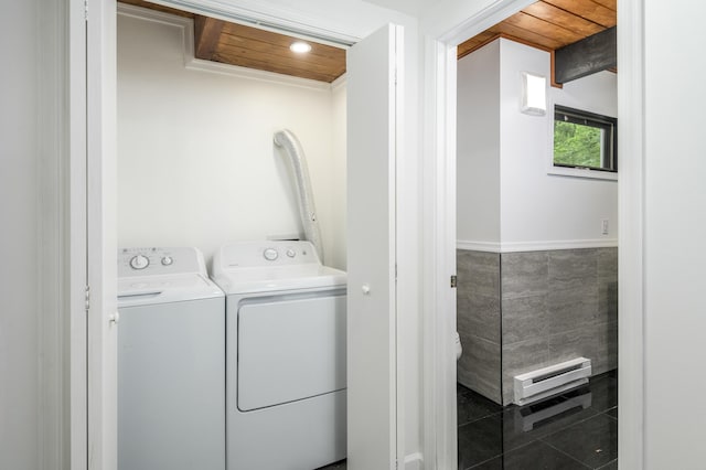 2162 Glasgow Dr, Bushkill, PA 18324 - laundry area with washing machine and dryer, a baseboard heating unit, and tile walls