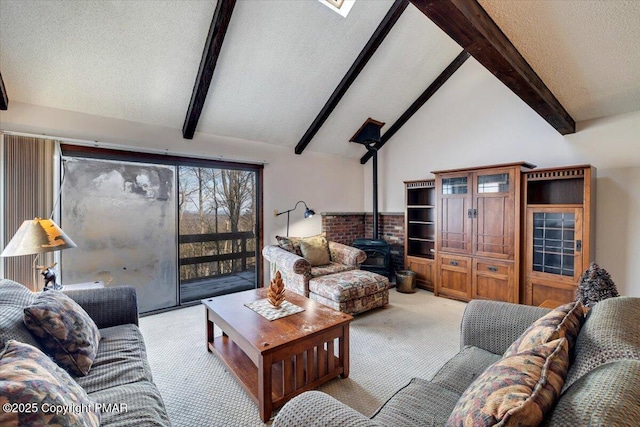 carpeted living room featuring a wood stove, lofted ceiling with beams, and a textured ceiling