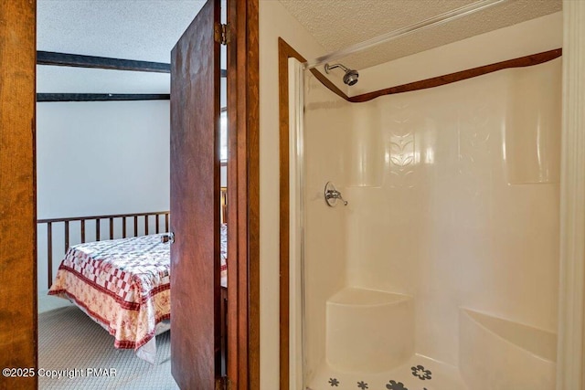 full bath with a shower stall and a textured ceiling