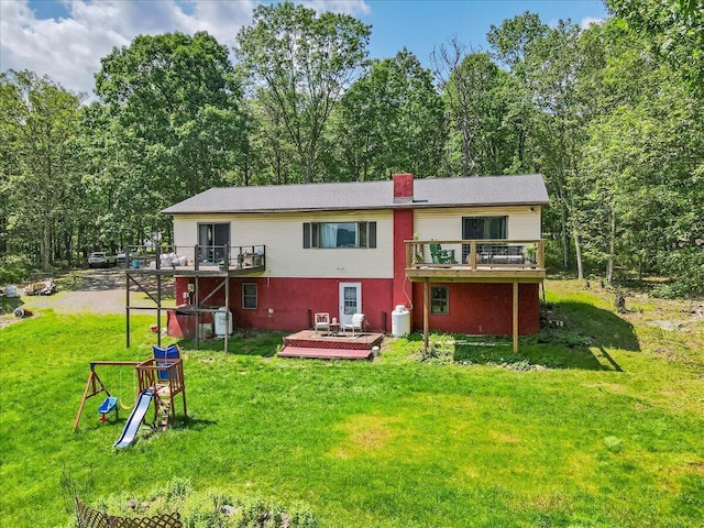 446 Dew Drop Dr, Jim Thorpe, PA 18229 - back of house with a deck, a lawn, and a chimney