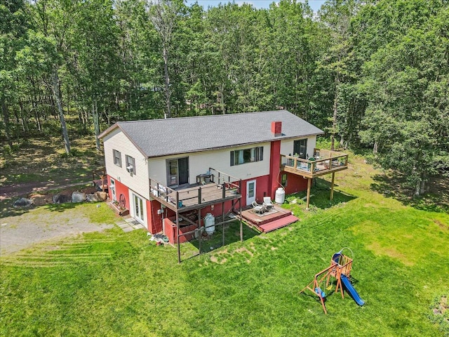 446 Dew Drop Dr, Jim Thorpe, PA 18229 - back of house with a wooden deck, dirt driveway, a lawn, and a forest view