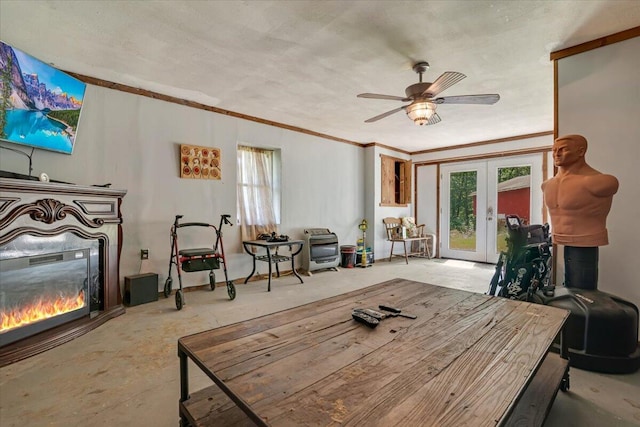 446 Dew Drop Dr, Jim Thorpe, PA 18229 - living room featuring a glass covered fireplace, french doors, healthy amount of natural light, a ceiling fan, and crown molding