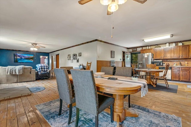 446 Dew Drop Dr, Jim Thorpe, PA 18229 - dining room featuring a ceiling fan, light wood-style floors, and crown molding