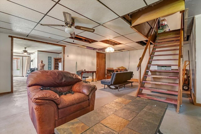 446 Dew Drop Dr, Jim Thorpe, PA 18229 - living room featuring ceiling fan, stairs, a drop ceiling, and concrete floors