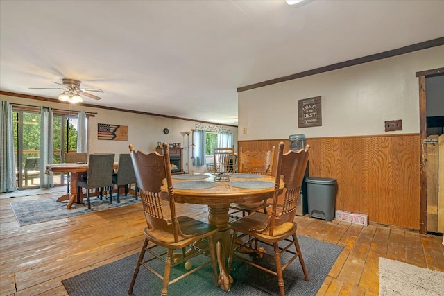 446 Dew Drop Dr, Jim Thorpe, PA 18229 - dining room featuring hardwood / wood-style floors, ornamental molding, wainscoting, plenty of natural light, and a ceiling fan
