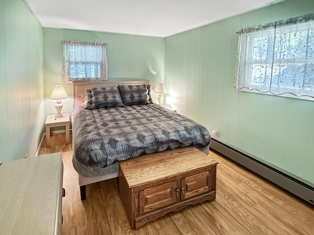 7537 Lake Shore Dr, Pocono Lake, PA 18347 - bedroom with baseboard heating and light wood-style flooring
