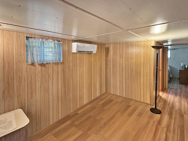 7537 Lake Shore Dr, Pocono Lake, PA 18347 - below grade area featuring an AC wall unit, wood finished floors, and wood walls