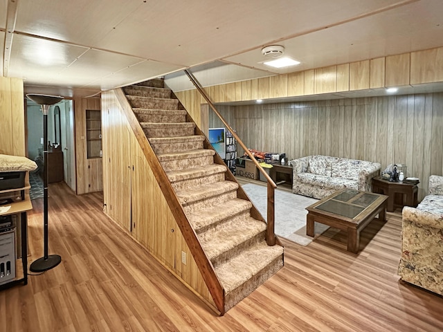 7537 Lake Shore Dr, Pocono Lake, PA 18347 - finished basement featuring wood walls, stairway, and light wood-style floors
