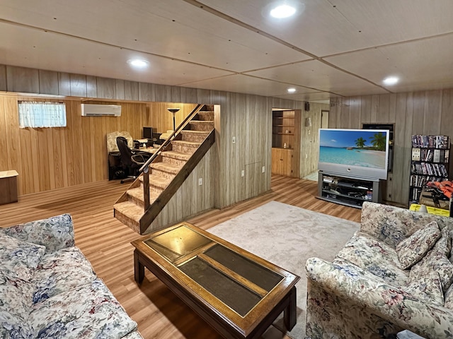 7537 Lake Shore Dr, Pocono Lake, PA 18347 - living area with a wall mounted AC, wooden walls, stairs, wood finished floors, and recessed lighting