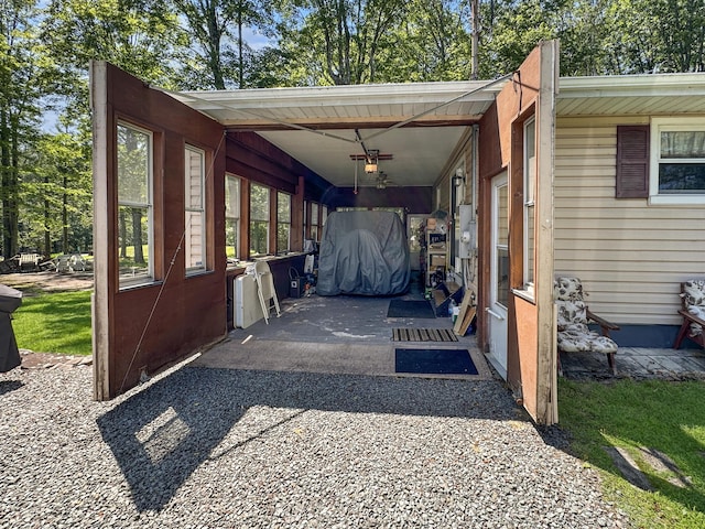 7537 Lake Shore Dr, Pocono Lake, PA 18347 - view of parking / parking lot featuring a ceiling fan and an attached carport