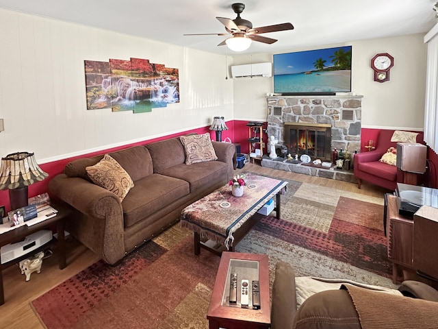 7537 Lake Shore Dr, Pocono Lake, PA 18347 - living room featuring a wall unit AC, wood finished floors, a ceiling fan, and a fireplace