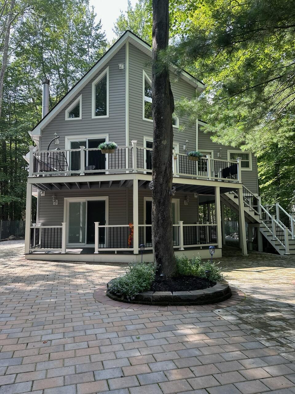 rear view of house featuring stairs