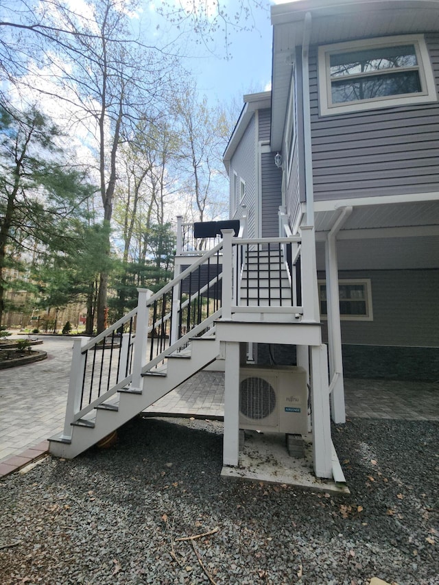 419 Quaker Ct, Pocono Lake, PA 18347 - view of patio / terrace featuring ac unit and stairs