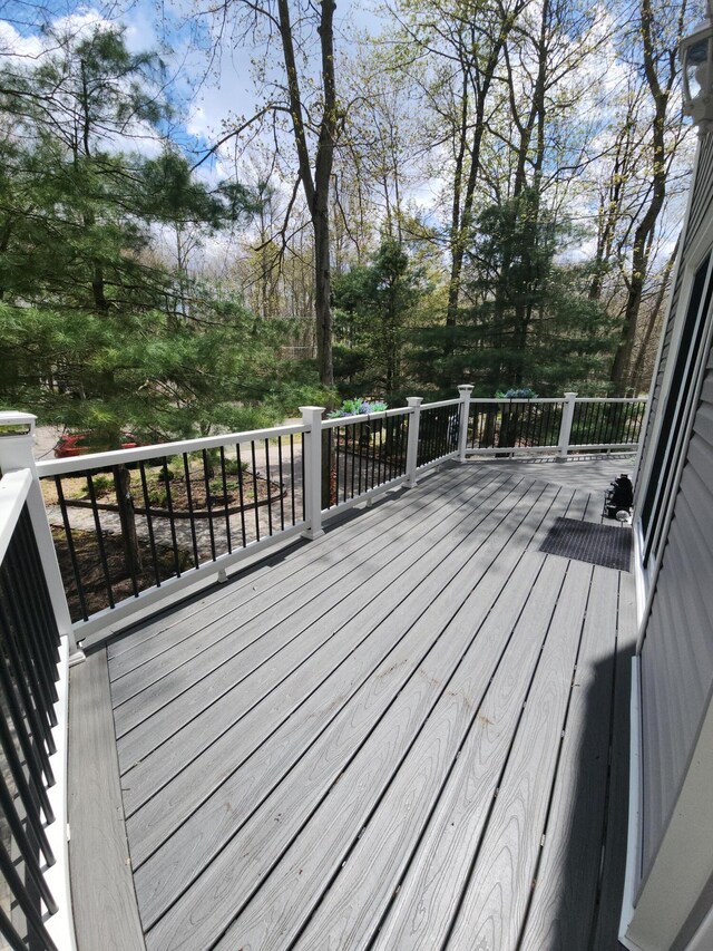 419 Quaker Ct, Pocono Lake, PA 18347 - wooden terrace with view of scattered trees