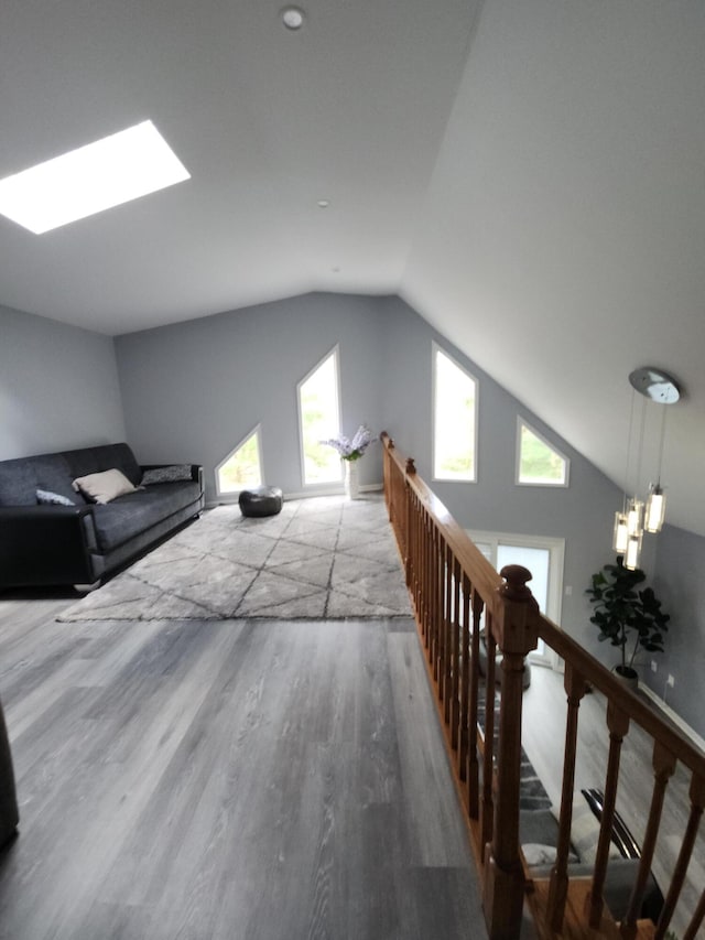 419 Quaker Ct, Pocono Lake, PA 18347 - bedroom with vaulted ceiling, wood finished floors, and a skylight