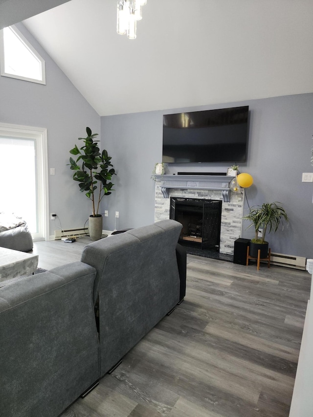 419 Quaker Ct, Pocono Lake, PA 18347 - living area with wood finished floors, a premium fireplace, high vaulted ceiling, and baseboard heating