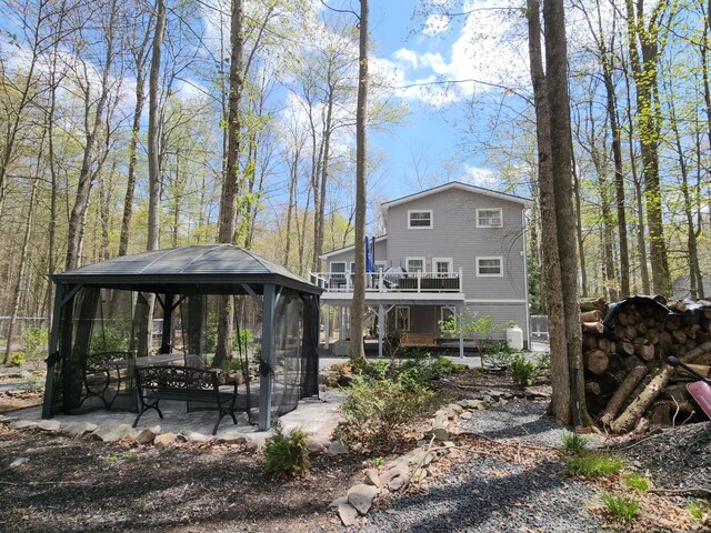 419 Quaker Ct, Pocono Lake, PA 18347 - back of house featuring a gazebo and a patio area