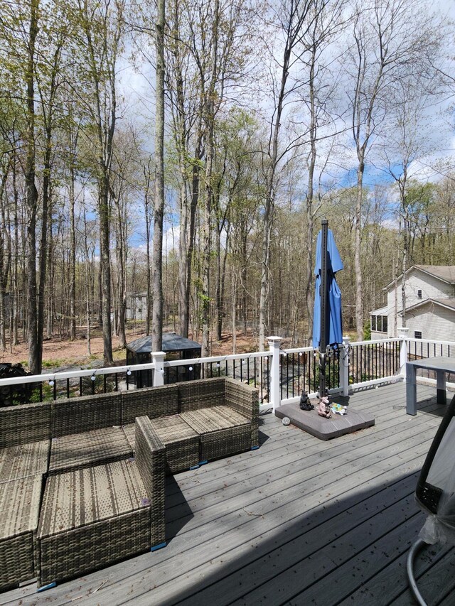 419 Quaker Ct, Pocono Lake, PA 18347 - wooden deck with view of scattered trees