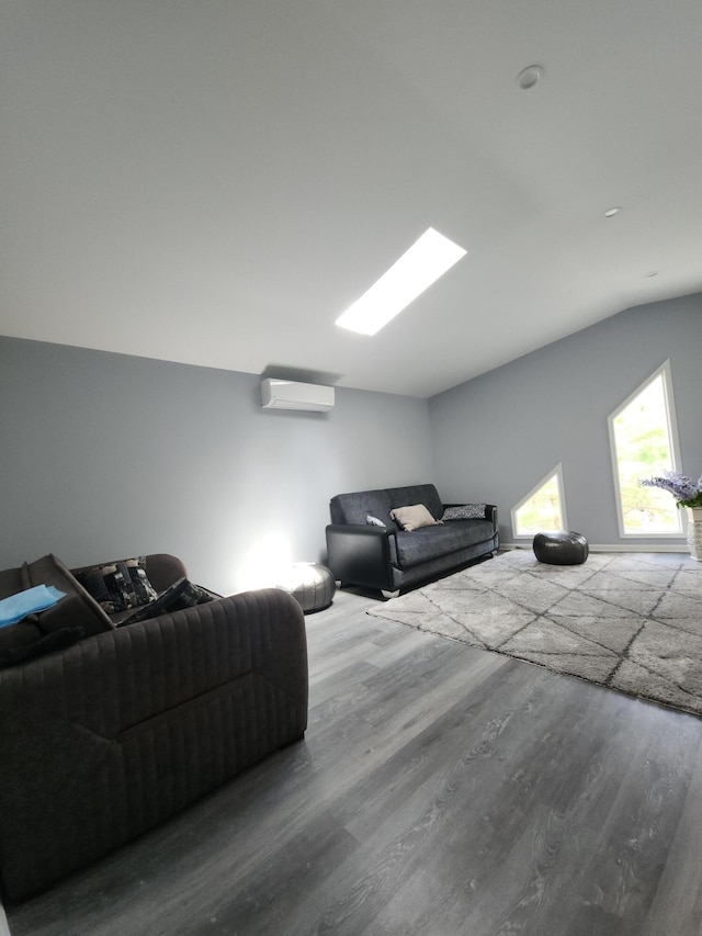 419 Quaker Ct, Pocono Lake, PA 18347 - living area featuring wood finished floors, vaulted ceiling, and an AC wall unit