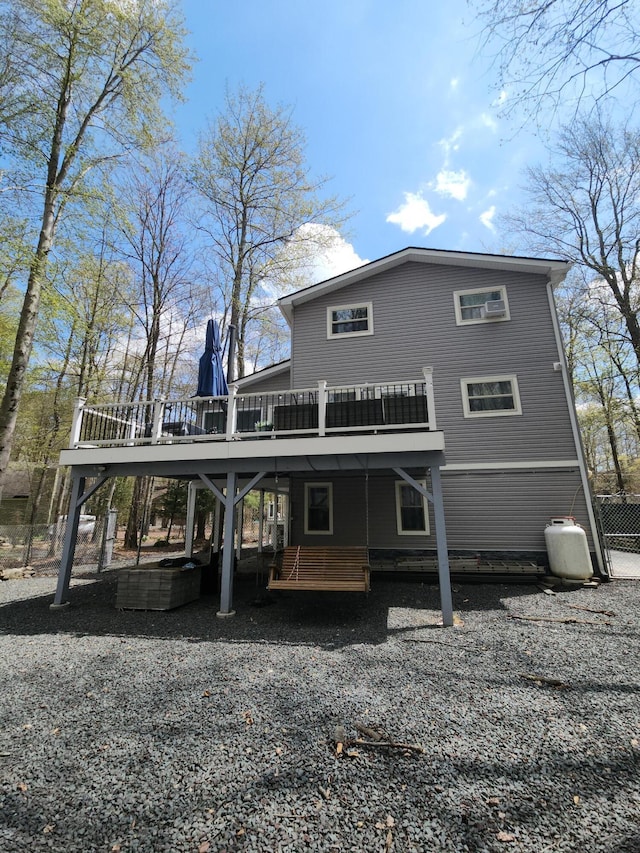 419 Quaker Ct, Pocono Lake, PA 18347 - back of property with gravel driveway and a deck