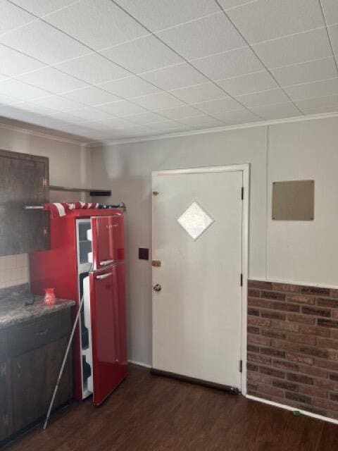 kitchen featuring crown molding and wood finished floors