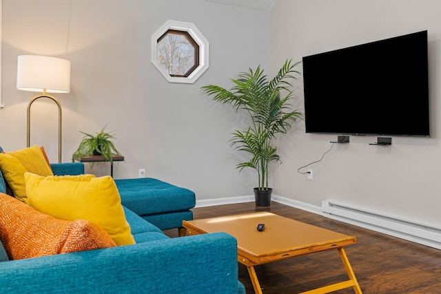 living room with a baseboard heating unit, wood finished floors, and baseboards