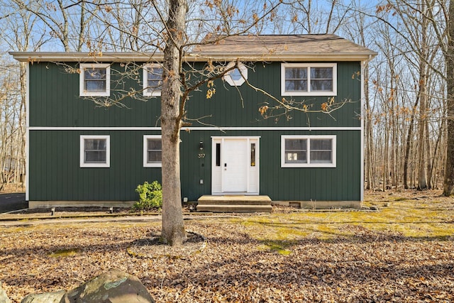 view of front of house featuring roof with shingles