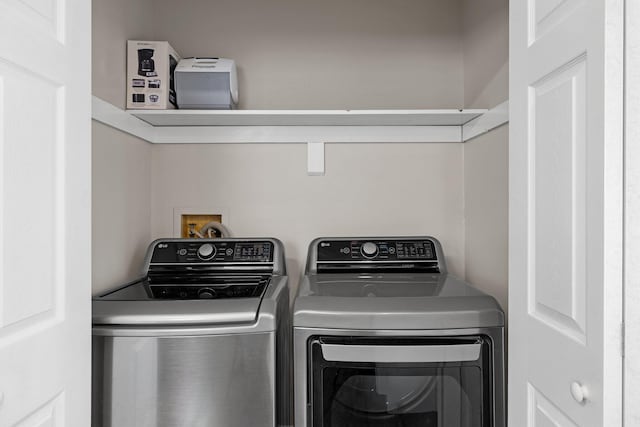 washroom with washer and dryer and laundry area