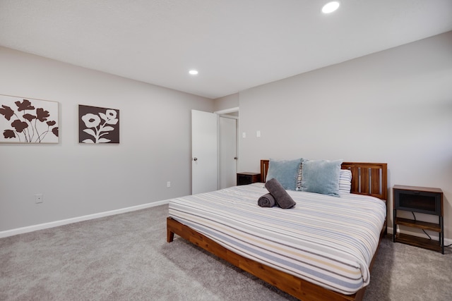 bedroom with recessed lighting, baseboards, and carpet floors