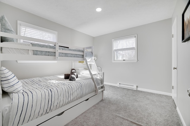 bedroom featuring baseboard heating, recessed lighting, baseboards, and carpet floors