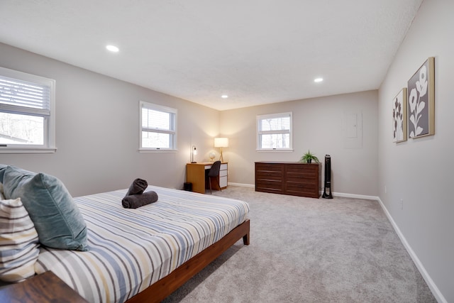 carpeted bedroom with recessed lighting, baseboards, and multiple windows