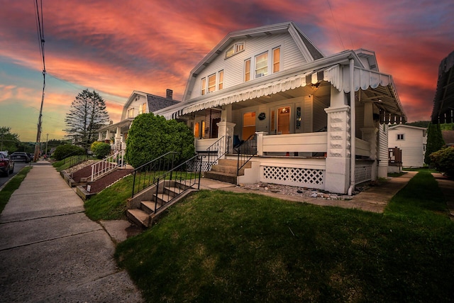 79 Stedman Ave, Lehighton, PA 18235 - view of front facade with a porch, a gambrel roof, and a yard