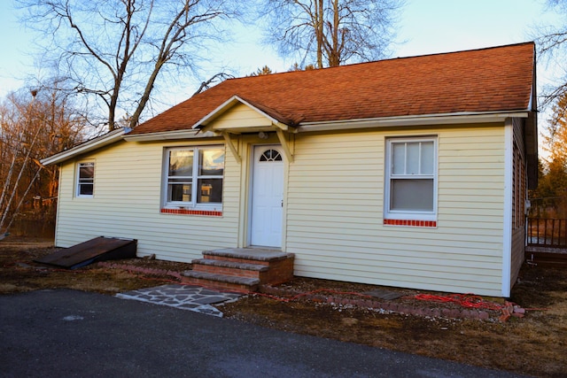 view of front of house with a shingled roof