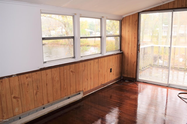 unfurnished sunroom featuring a baseboard heating unit and lofted ceiling