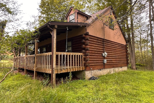 9416 Juniper Dr, Tobyhanna, PA 18466 - view of property exterior with log siding and a wooden deck